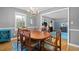 A dining room that features a window, hardwood flooring and access to other living spaces at 1959 Audubon Ne Dr, Atlanta, GA 30329