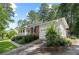 Brick exterior home with an attached garage and well-kept lawn and mature trees at 1959 Audubon Ne Dr, Atlanta, GA 30329