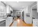 A modern kitchen featuring stainless steel appliances, white cabinets and hardwood floors at 1959 Audubon Ne Dr, Atlanta, GA 30329