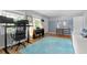 Bright living room with modern decor, hardwood floors, and a comfortable office setup at 1959 Audubon Ne Dr, Atlanta, GA 30329