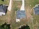 An aerial view capturing a property's backyard layout, including the patio and surrounding landscape at 293 Ironwood Dr, Stockbridge, GA 30281
