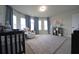 Beautiful Bedroom featuring carpet floors, natural light, and cozy furniture at 293 Ironwood Dr, Stockbridge, GA 30281