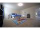 Bright bedroom offers carpet floors, natural light, and a comfortable bed at 293 Ironwood Dr, Stockbridge, GA 30281