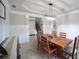 Open-concept dining room showcasing natural light, stylish decor, and easy access to stairs at 293 Ironwood Dr, Stockbridge, GA 30281