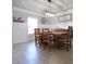 Well-lit dining area boasts a tray ceiling, decorative wall trim, and tile floors at 293 Ironwood Dr, Stockbridge, GA 30281