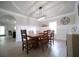 Spacious dining area includes stylish lighting, tray ceiling and light tile flooring at 293 Ironwood Dr, Stockbridge, GA 30281