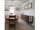 Elegant dining room featuring modern light fixture, wainscoting, and stylish decor at 293 Ironwood Dr, Stockbridge, GA 30281