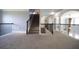 Upper hallway with decorative iron railing overlooking the main floor and staircase at 293 Ironwood Dr, Stockbridge, GA 30281