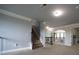Hallway with railing, stairs, and arched openings at 293 Ironwood Dr, Stockbridge, GA 30281