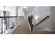 Upper hallway with decorative iron railing overlooking the main floor and staircase at 293 Ironwood Dr, Stockbridge, GA 30281