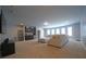Bright living room featuring a wet bar, complemented by comfortable seating and multiple windows for natural light at 293 Ironwood Dr, Stockbridge, GA 30281