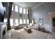 Spacious living room featuring high ceilings, large windows, and a comfortable seating area at 293 Ironwood Dr, Stockbridge, GA 30281