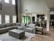 Bright living room with sectional sofa, and open view to kitchen at 293 Ironwood Dr, Stockbridge, GA 30281