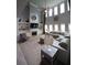 Spacious living room featuring a fireplace, built-ins, and plenty of natural light at 293 Ironwood Dr, Stockbridge, GA 30281