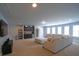 Expansive living room with wet bar, offering ample seating and natural light from several large windows at 293 Ironwood Dr, Stockbridge, GA 30281