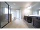 Modern main bathroom with glass shower, separate soaking tub, and dark vanity at 293 Ironwood Dr, Stockbridge, GA 30281