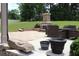 Inviting patio space featuring a stone fireplace and outdoor dining area, perfect for entertaining guests at 293 Ironwood Dr, Stockbridge, GA 30281