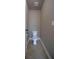 Small powder room features tile flooring and a white toilet at 293 Ironwood Dr, Stockbridge, GA 30281