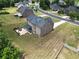 Aerial image highlighting the home's backyard and its cozy patio, perfect for summer evenings at 293 Ironwood Dr, Stockbridge, GA 30281