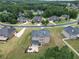 Aerial view of home's rear exterior showcasing a patio area perfect for outdoor entertaining and relaxing at 293 Ironwood Dr, Stockbridge, GA 30281
