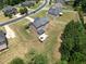 Overhead shot displaying the house's back exterior with a lovely backyard and patio area for gatherings at 293 Ironwood Dr, Stockbridge, GA 30281