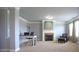 Bright sitting area featuring a cozy fireplace and large windows at 293 Ironwood Dr, Stockbridge, GA 30281