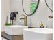 Elegant bathroom featuring dual vessel sinks, waterfall faucets, and stylish decor at 3408 Phillips Cir, Decatur, GA 30032