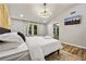 Spacious bedroom with a vaulted ceiling, large windows, modern lighting, and a serene atmosphere at 3408 Phillips Cir, Decatur, GA 30032