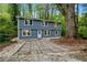 Charming two-story home with updated exterior paint, a front yard, and well-maintained landscaping at 3408 Phillips Cir, Decatur, GA 30032