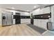 Bright, updated kitchen with stainless steel appliances, white cabinets, and sleek black countertops at 3408 Phillips Cir, Decatur, GA 30032