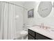 Bathroom featuring a combination bathtub and shower with white curtain, and a vanity with dark cabinets at 3804 Tattenhall Drive Dr, Cumming, GA 30040