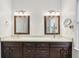 Bathroom with dual vanities and dark wood cabinets at 3804 Tattenhall Drive Dr, Cumming, GA 30040