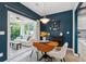 Cozy dining area adjacent to sunroom and kitchen featuring stylish decor at 3804 Tattenhall Drive Dr, Cumming, GA 30040