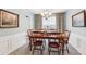 Well-lit dining room with a chandelier and seating for six people at 3804 Tattenhall Drive Dr, Cumming, GA 30040