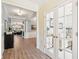 Welcoming foyer with wood floors, french doors, and an open view to the living room at 3804 Tattenhall Drive Dr, Cumming, GA 30040