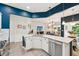 An open-concept kitchen showcases granite countertops, stainless steel appliances, and adjacent living area at 3804 Tattenhall Drive Dr, Cumming, GA 30040