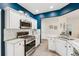 A modern kitchen features white cabinets, stainless steel appliances, and granite countertops at 3804 Tattenhall Drive Dr, Cumming, GA 30040