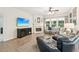Inviting living room with a fireplace, television, and comfortable seating at 3804 Tattenhall Drive Dr, Cumming, GA 30040