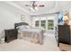 Spacious main bedroom featuring a tray ceiling, large windows, and neutral decor at 3804 Tattenhall Drive Dr, Cumming, GA 30040