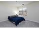 Simple bedroom design with a comfortable bed and a window providing natural light at 21 Queen Anne Se Dr, Mableton, GA 30126