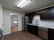 Modern kitchen featuring stainless steel appliances, dark cabinets and an adjacent dining area at 21 Queen Anne Se Dr, Mableton, GA 30126