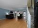 Spacious living room featuring hardwood floors, a fireplace, and a staircase leading to the second floor at 21 Queen Anne Se Dr, Mableton, GA 30126