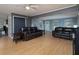 Inviting living room featuring hardwood floors, two sofas, and an open staircase at 21 Queen Anne Se Dr, Mableton, GA 30126