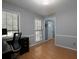 Bright office space with hardwood floors, a modern black desk and natural light at 21 Queen Anne Se Dr, Mableton, GA 30126