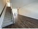 Open-concept living space with modern flooring, recessed lighting, stairs and view of kitchen at 5447 Blossomwood Sw Trl, Mableton, GA 30126