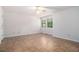 Neutral bedroom with ceramic tile floors and a ceiling fan at 1180 Springs Dr, Canton, GA 30115