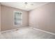 Neutral bedroom with light-colored carpet, ceiling fan, and a window bringing in lots of light at 1180 Springs Dr, Canton, GA 30115