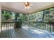 Covered deck with green painted wood and view of lush backyard landscaping at 1180 Springs Dr, Canton, GA 30115