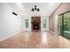 Living room with a vaulted ceiling showcases a stone fireplace and ceramic tile floors at 1180 Springs Dr, Canton, GA 30115