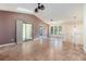 Spacious living room features ceramic tile floors, high vaulted ceiling, and sliding glass door access to the deck at 1180 Springs Dr, Canton, GA 30115